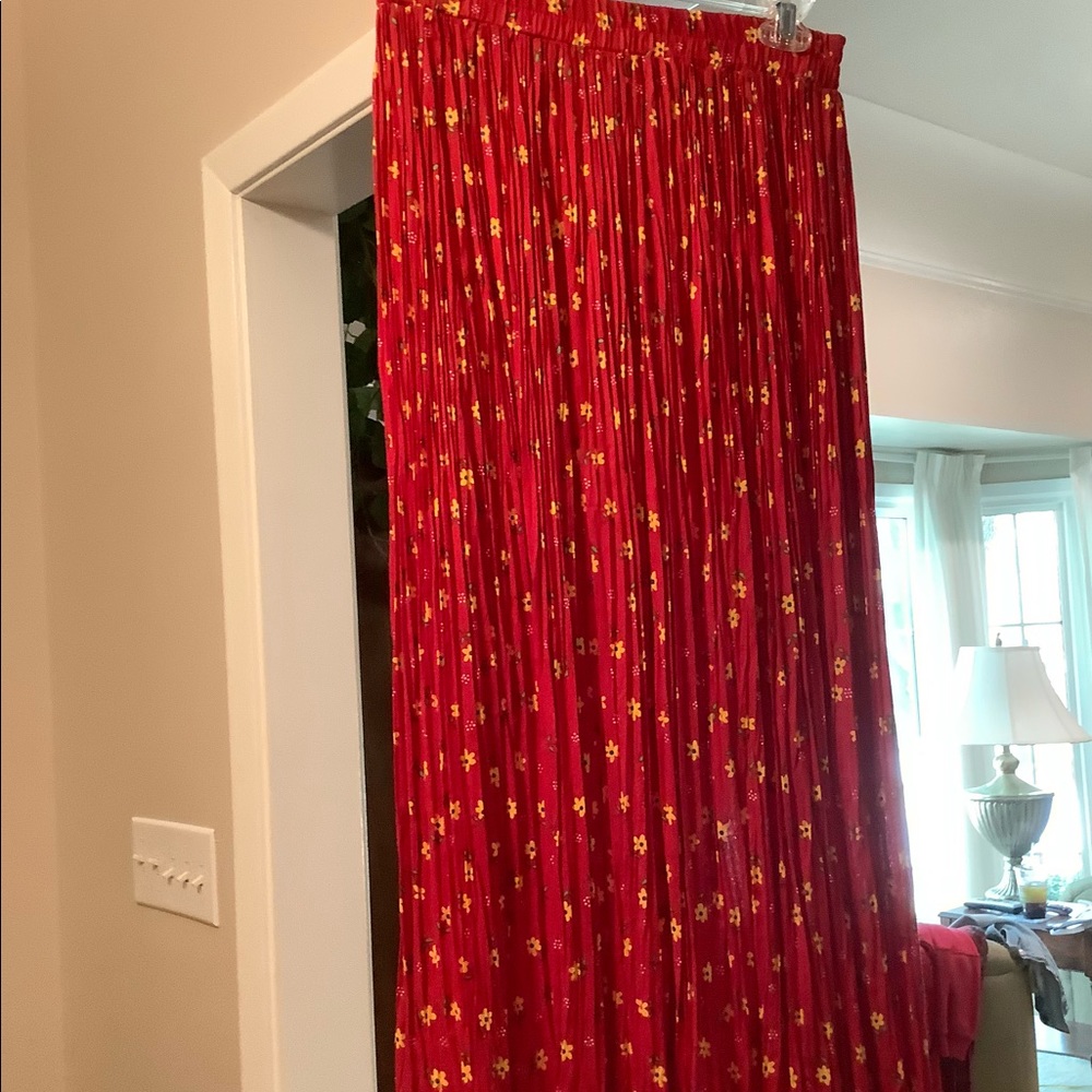 This s is a red broom skirt that is in like new condition.